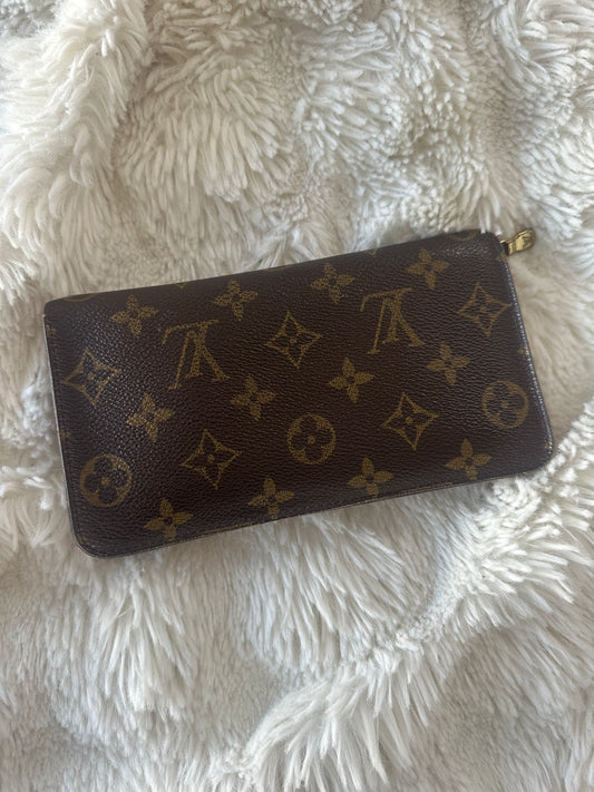Louis Vuitton zippy wallet with zip coin pocket.