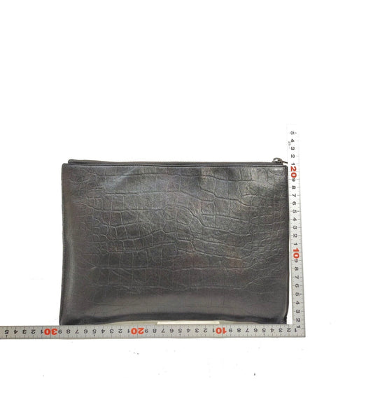 Saint Laurent black leather croc print clutch bag.