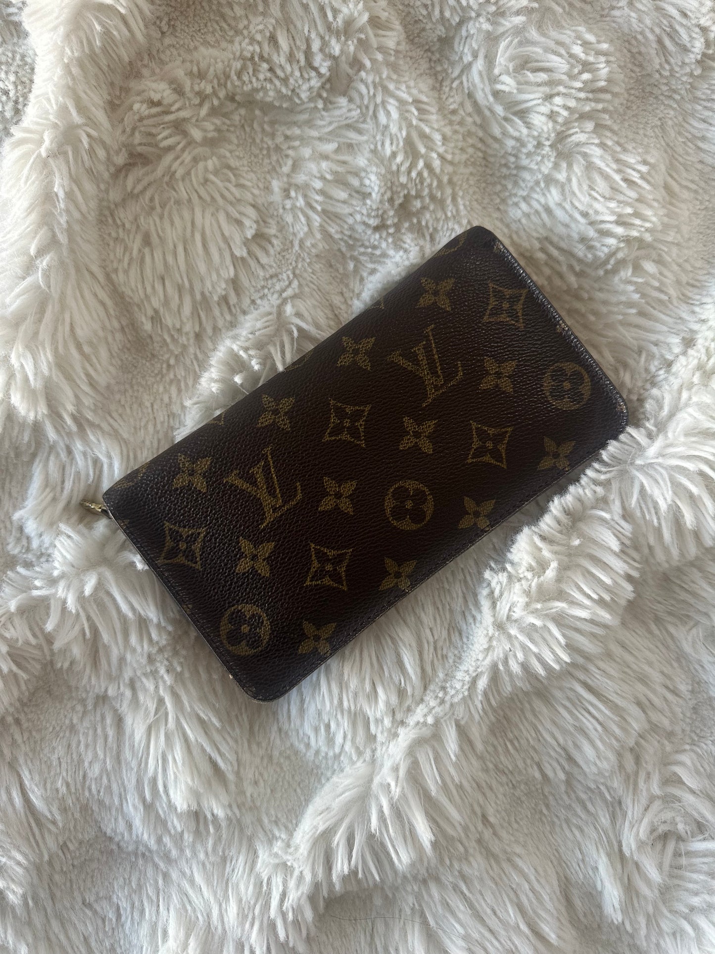 Louis Vuitton zippy wallet with zip coin pocket.