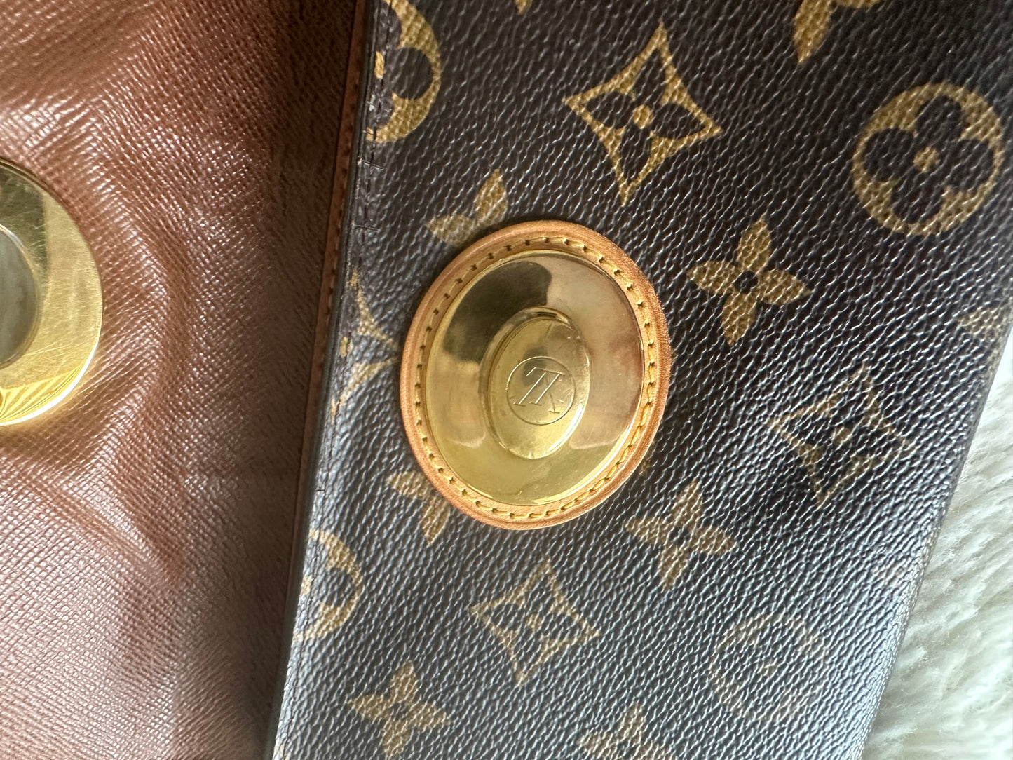 Louis Vuitton vintage boetie monogram with brass lock on chain crossbody bag.