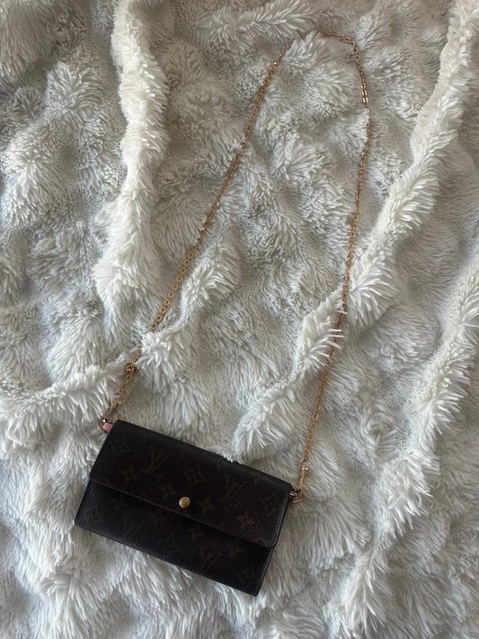 Louis Vuitton monogram wallet on chain shoulder bag.
