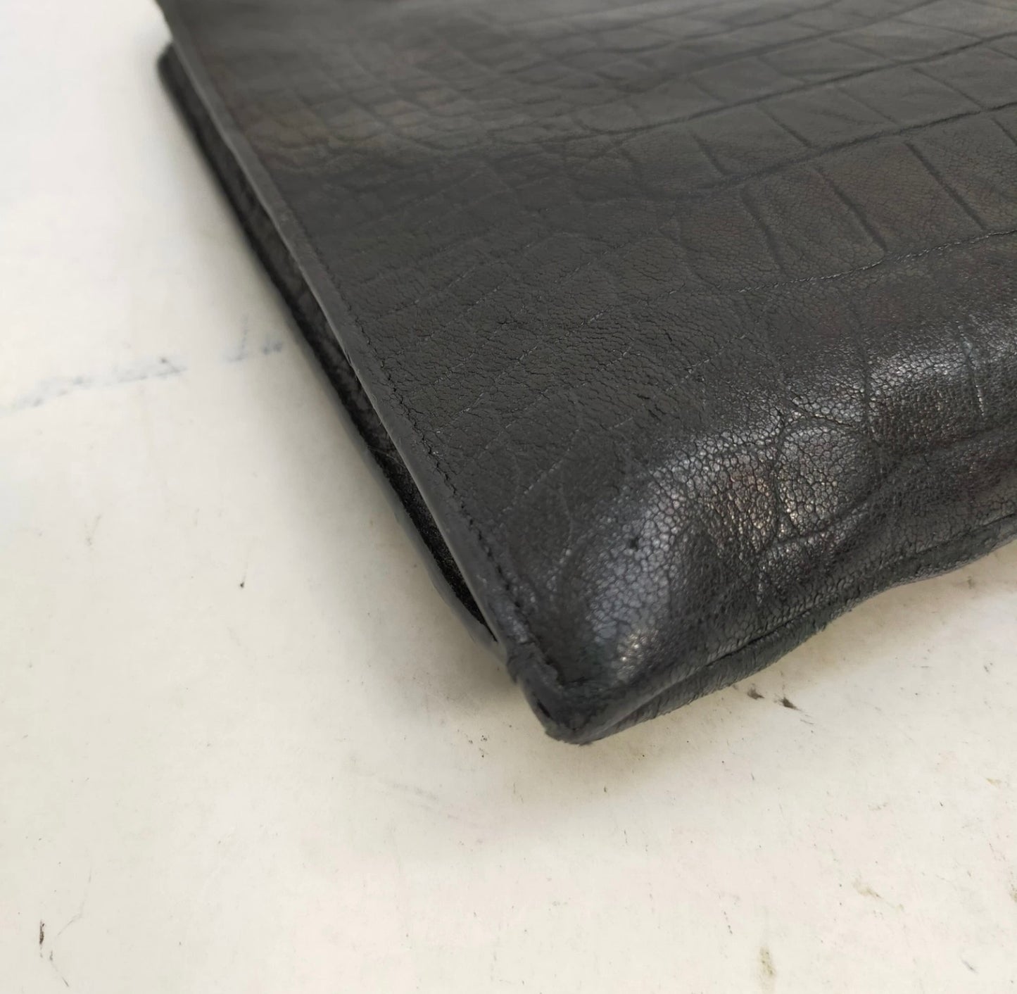 Saint Laurent black leather croc print clutch bag.