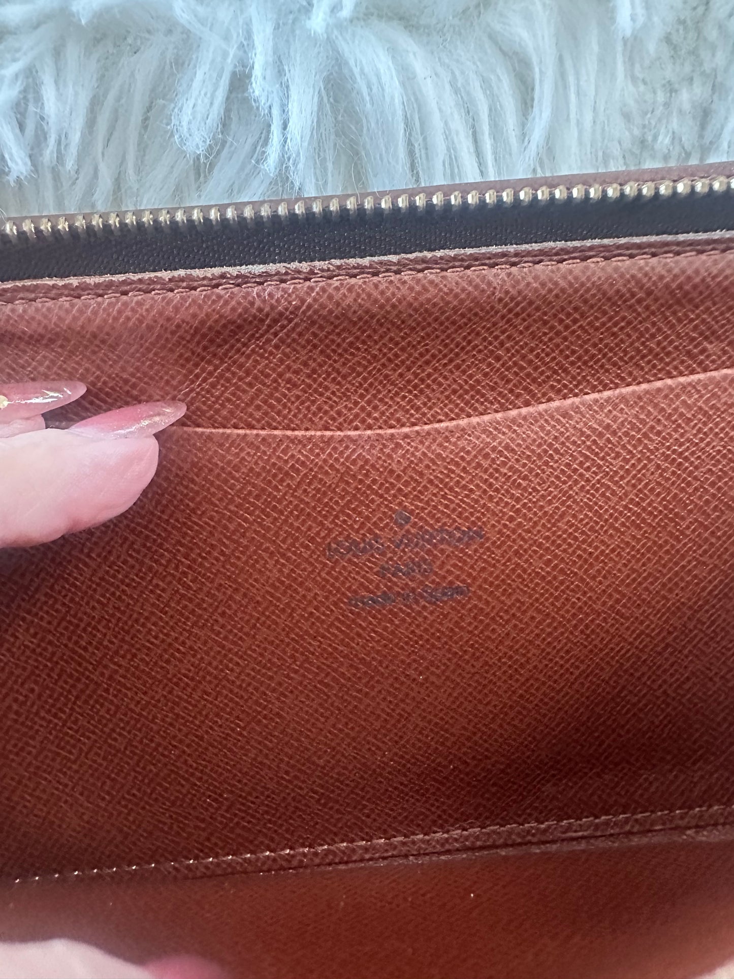 Louis Vuitton zippy wallet with zip coin pocket.