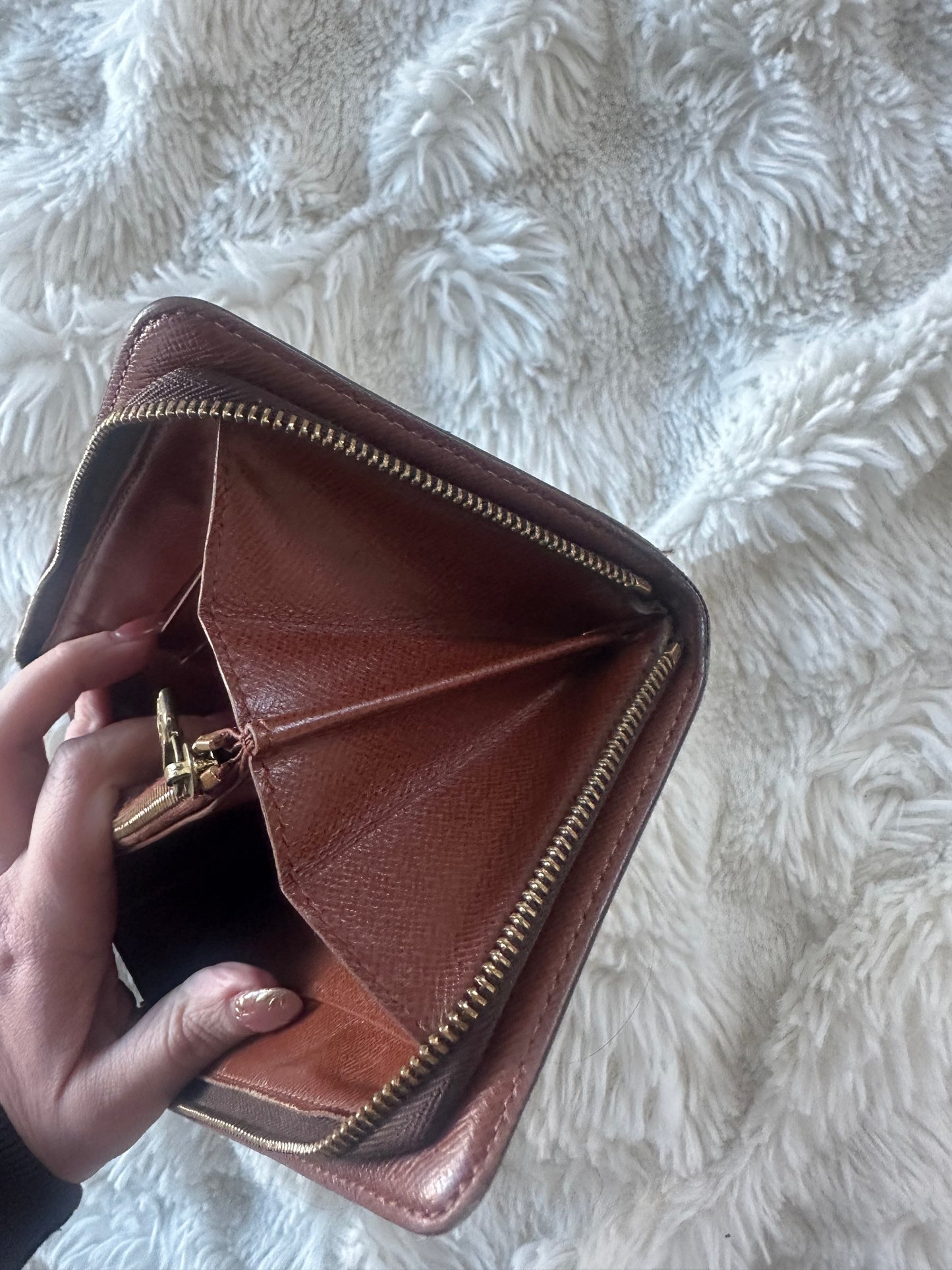 Louis Vuitton zippy wallet with zip coin pocket.