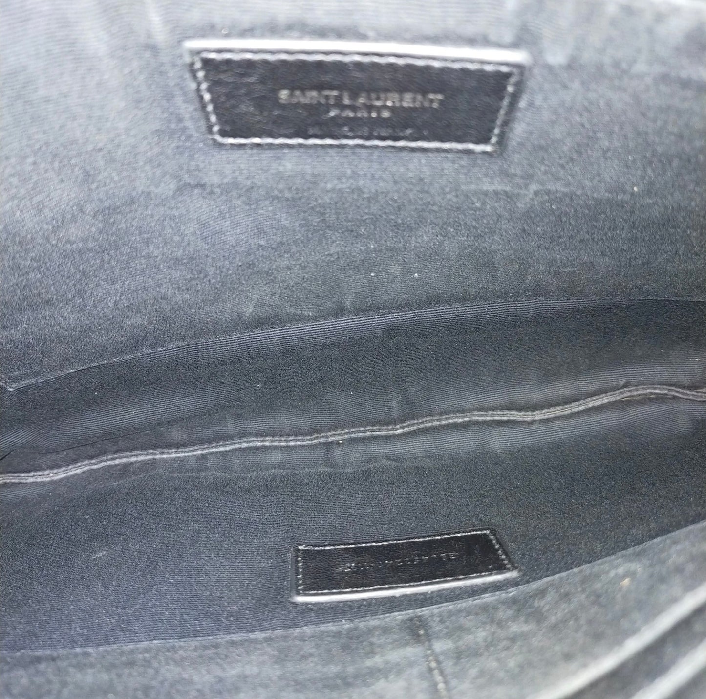 Saint Laurent black leather croc print clutch bag.