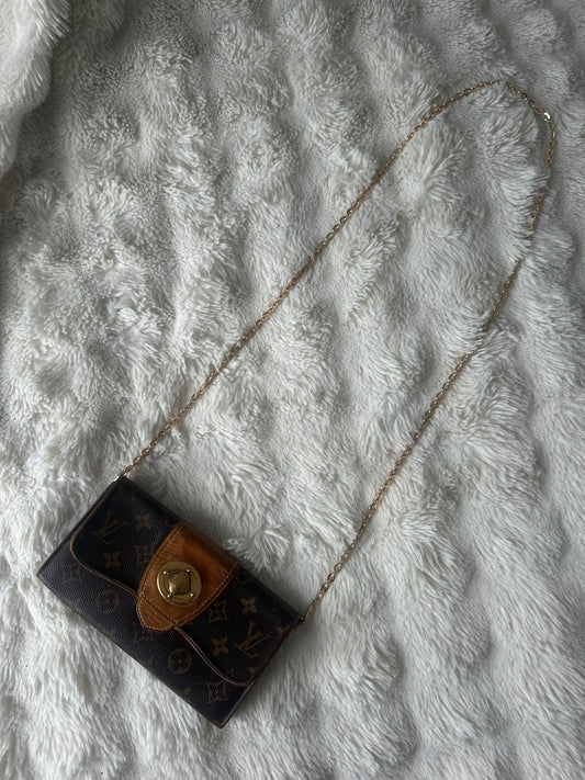 Louis Vuitton vintage boetie monogram with brass lock on chain crossbody bag.