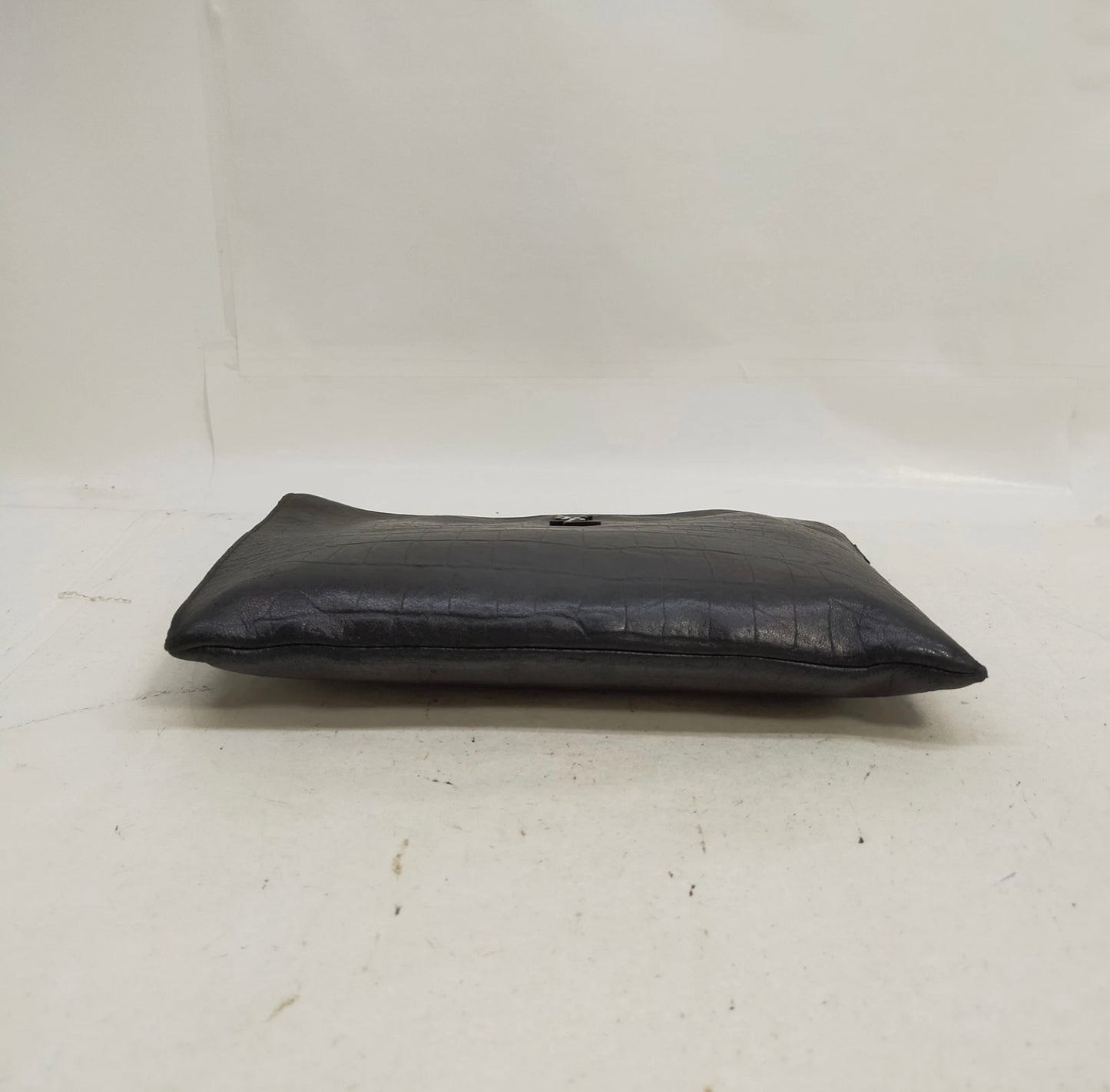 Saint Laurent black leather croc print clutch bag.