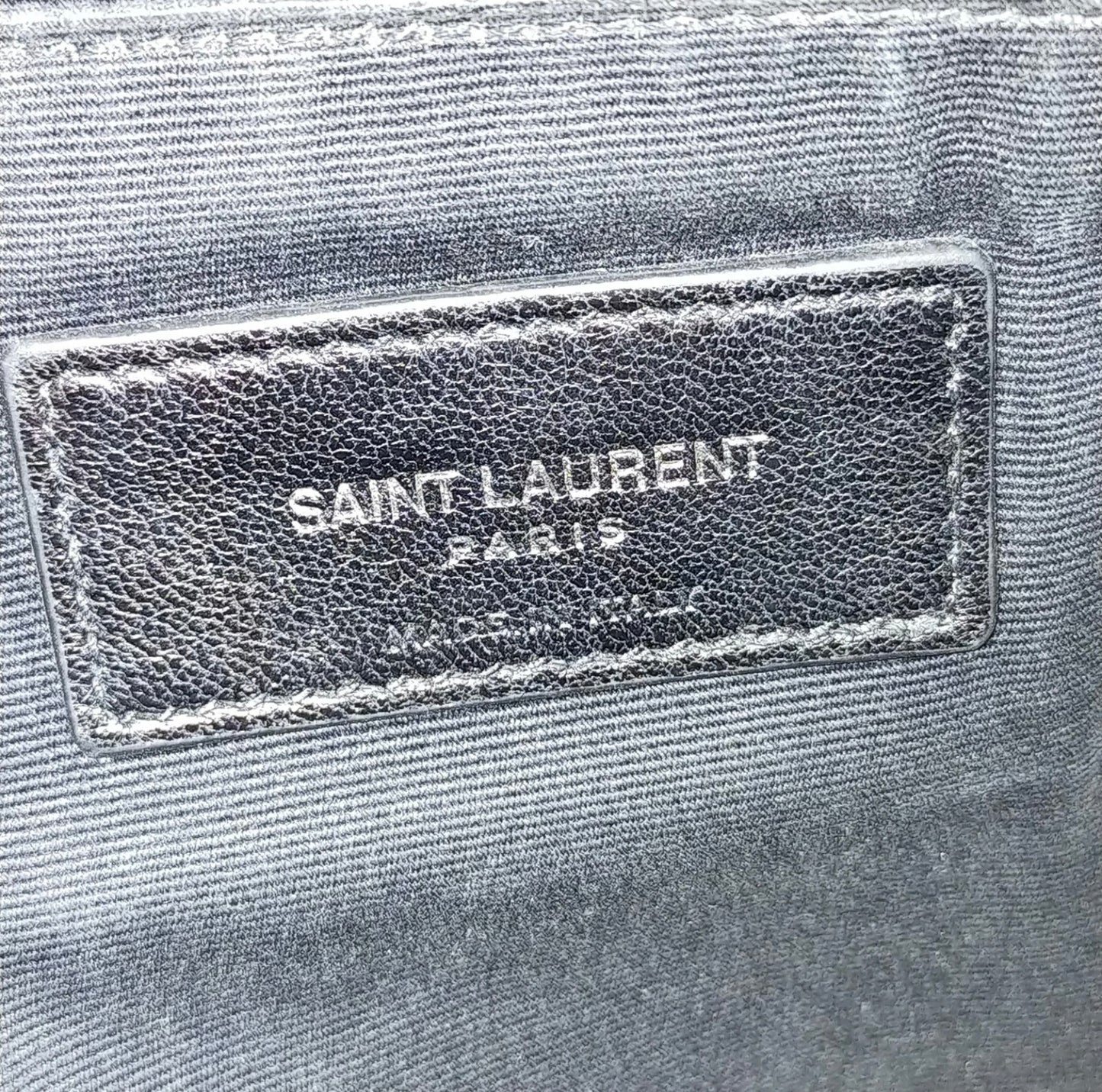 Saint Laurent black leather croc print clutch bag.